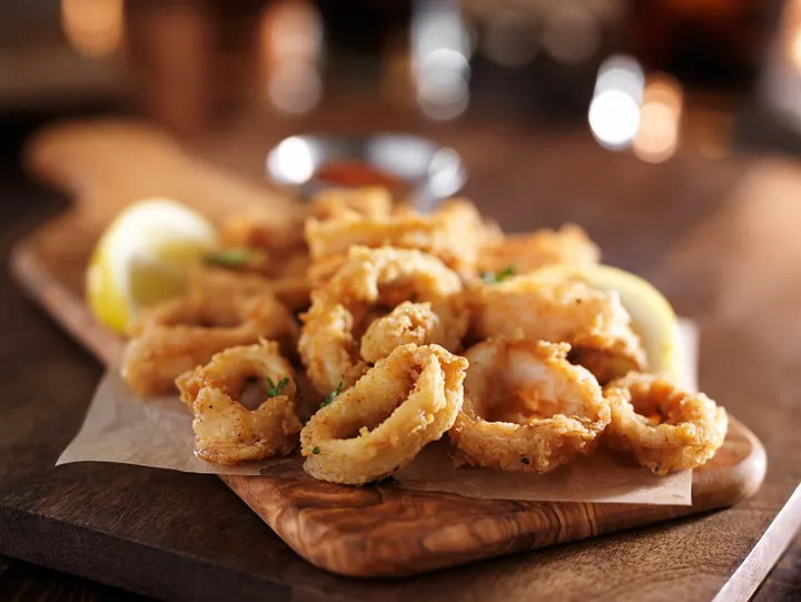 Fried calamari with lemon for banquet appetizers